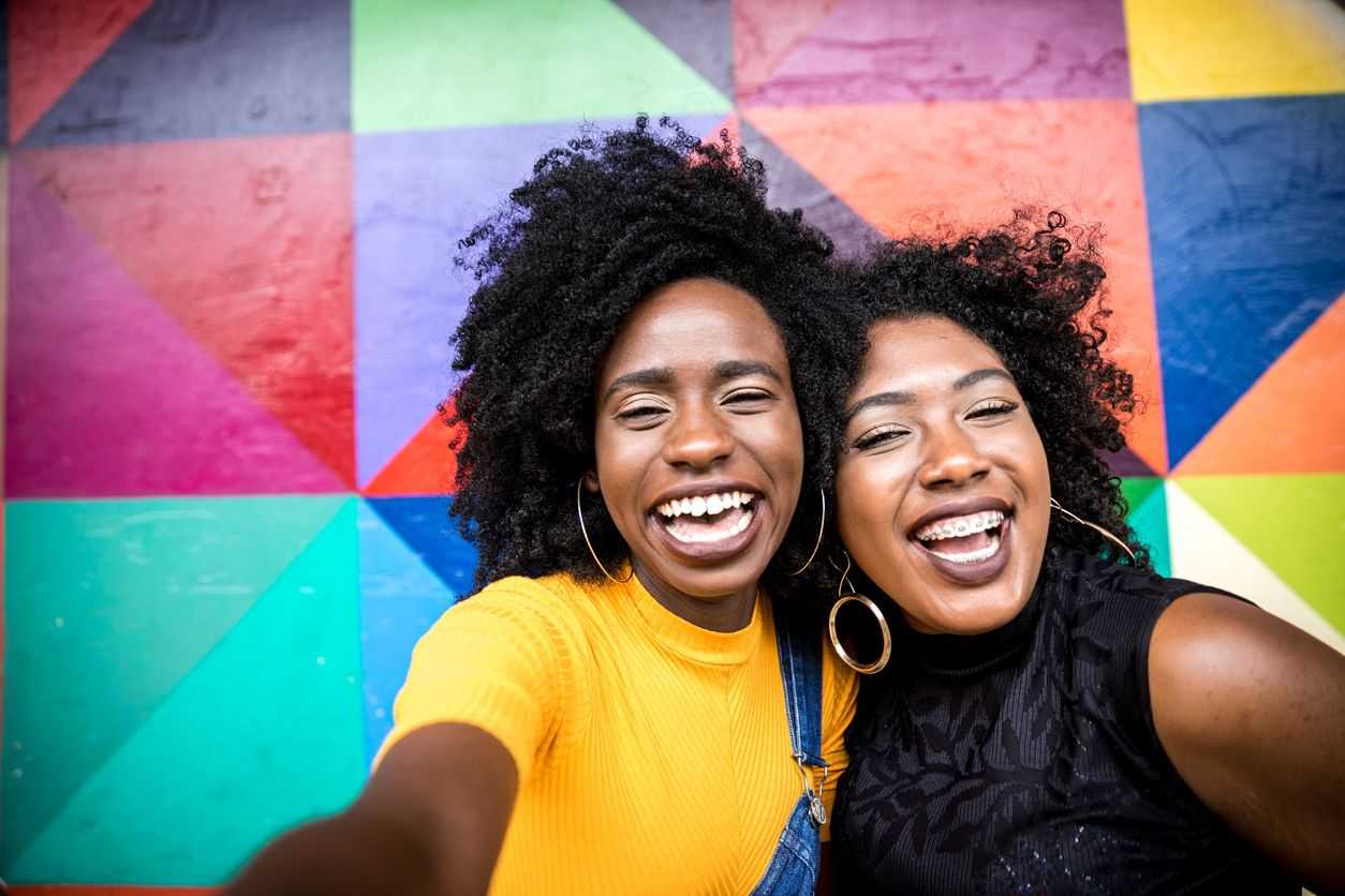 Two women smiling taking a selfie