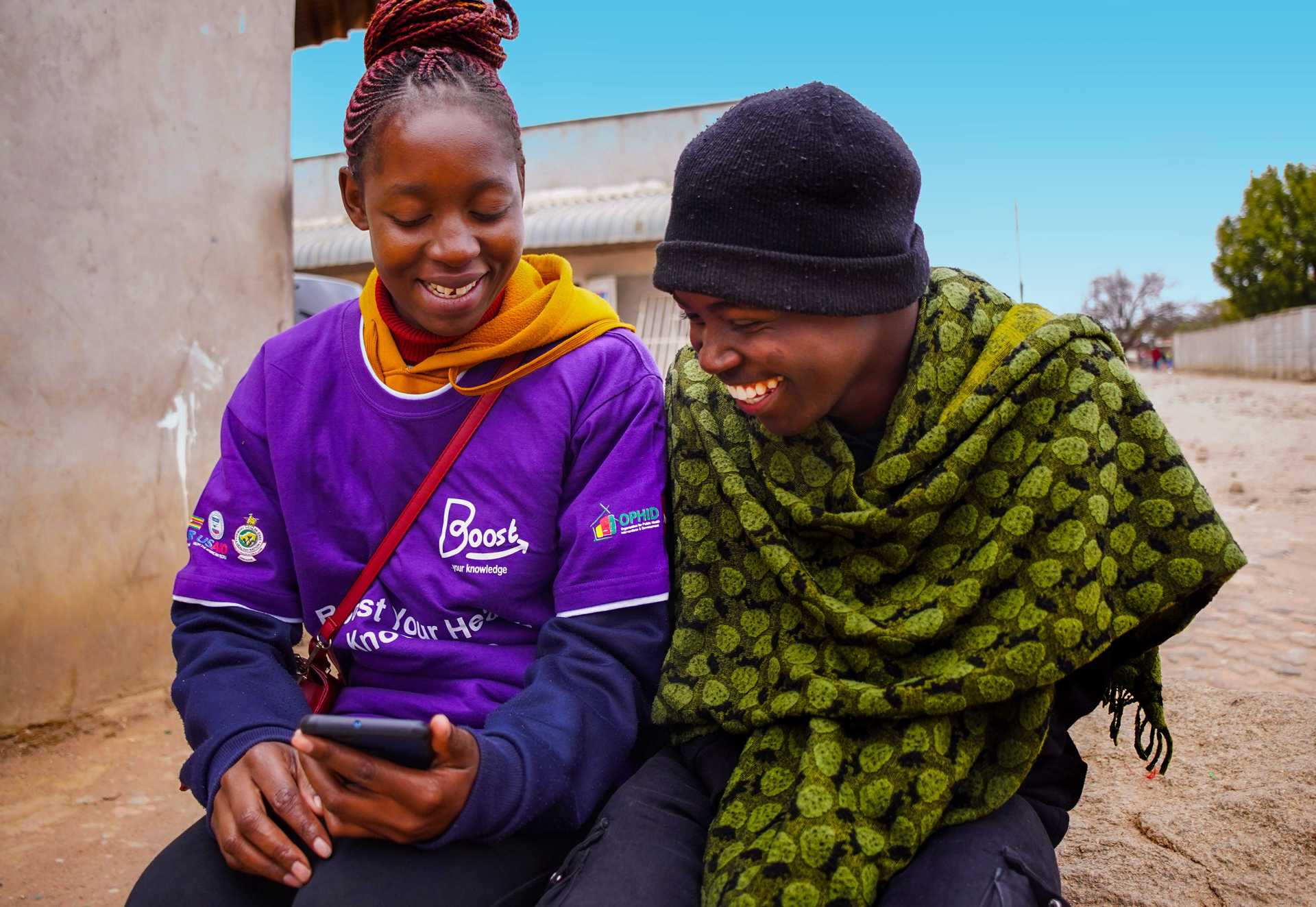 Community health workers and client using Boost