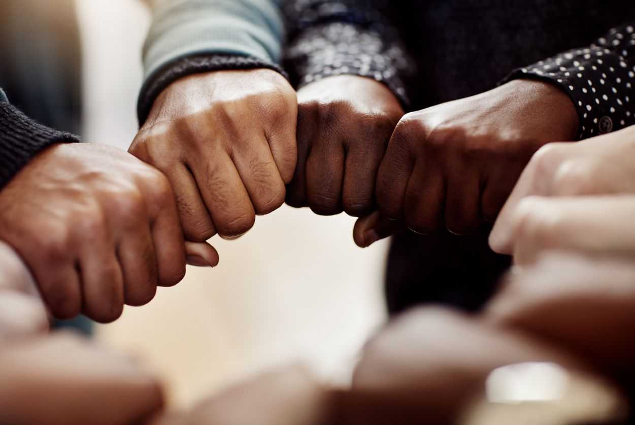 Group of hands forming a circle